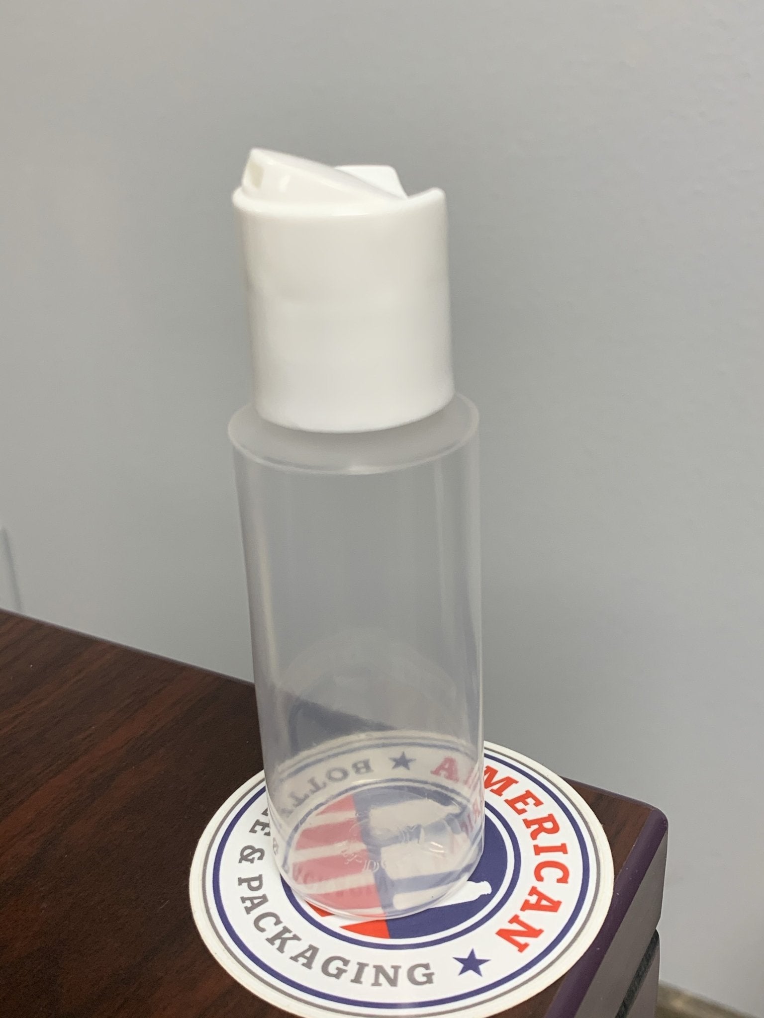 2oz PP Cylinder with White Disc Cap - Rock Bottom Bottles / Packaging Company LLC